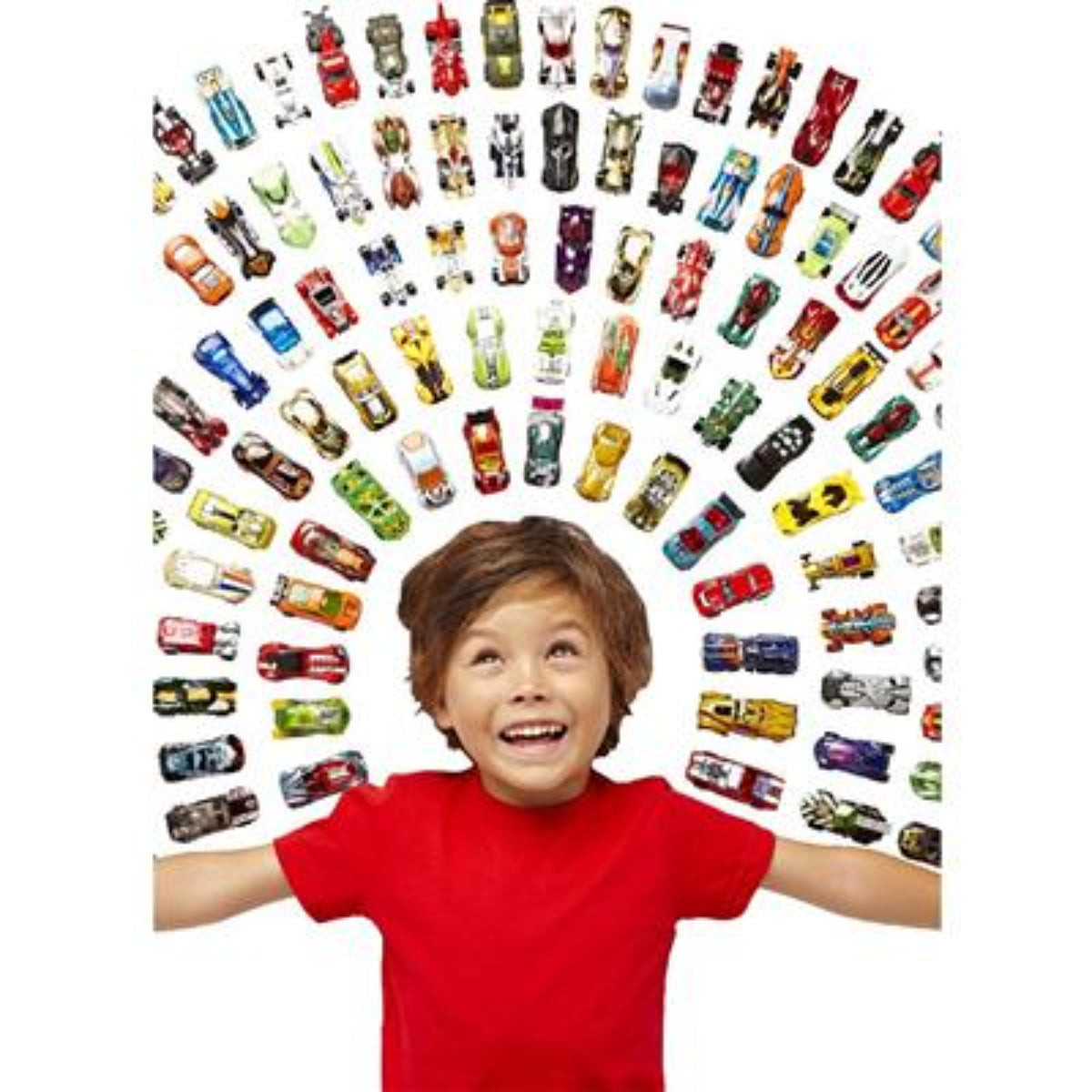 Child in a red shirt surrounded by a large number of small toy cars on a white background