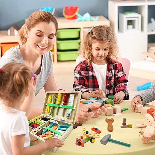 Woman and children playing with toy tools and construction set in a classroom setting.