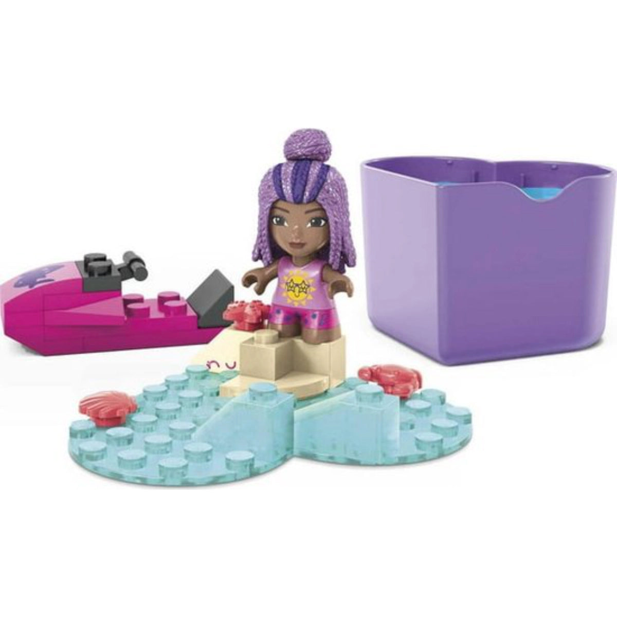 Toy set with a character on a beach, including a boat and sandcastle, on a white background.