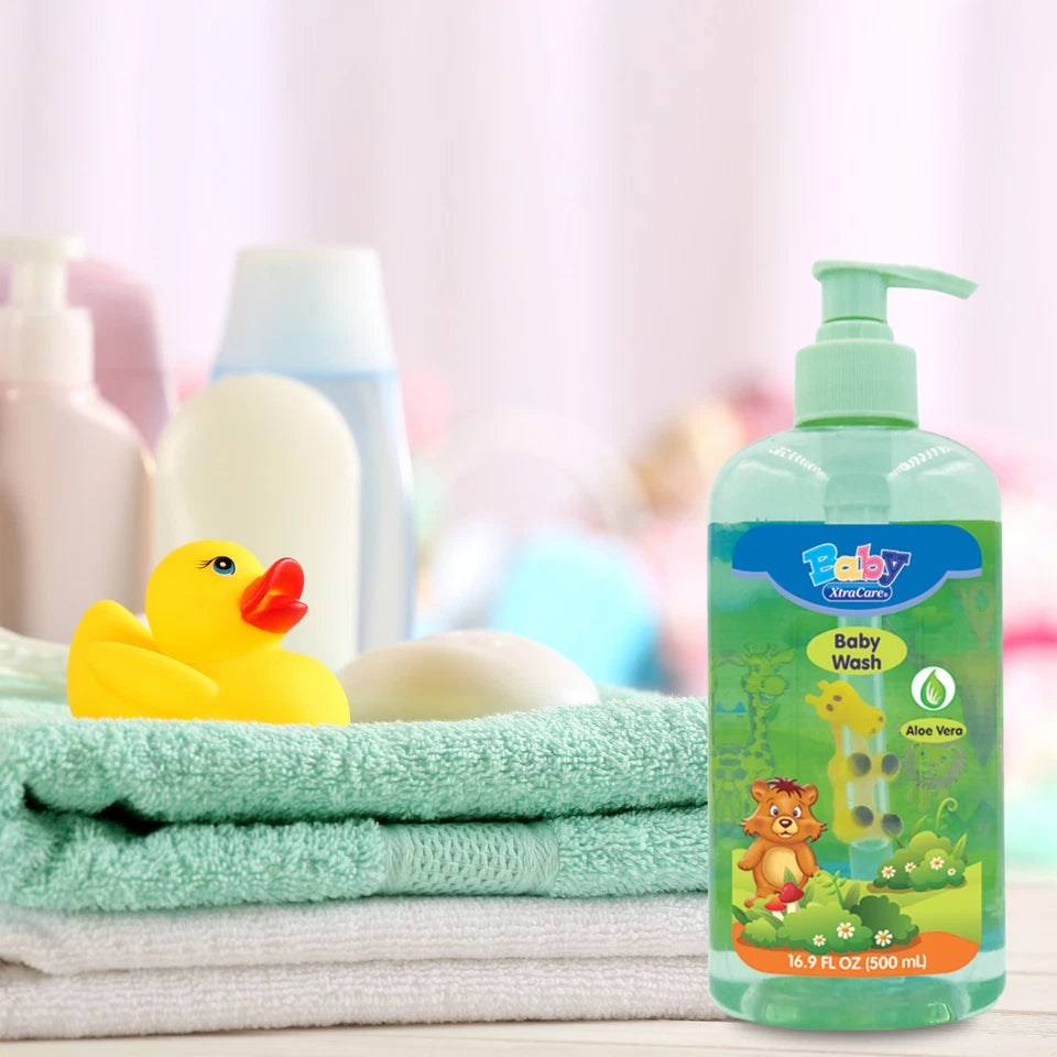 Baby wash bottle with towels and a rubber duck on a light background