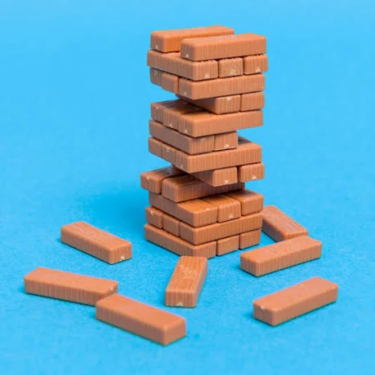Stack of brown wooden blocks on a blue background